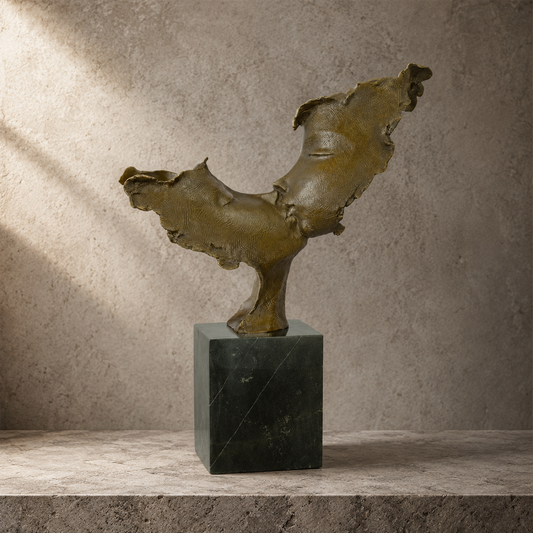 Sculpture bronze deux visages enlacés sur socle marbre